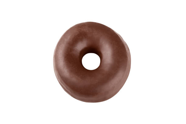 istock Donut covered with chocolate frosting isolated on a white background. Delicious chocolate doughnut. 1287440085