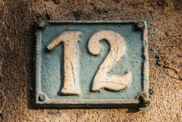 istock Old retro cast iron plate number 12 1287440144