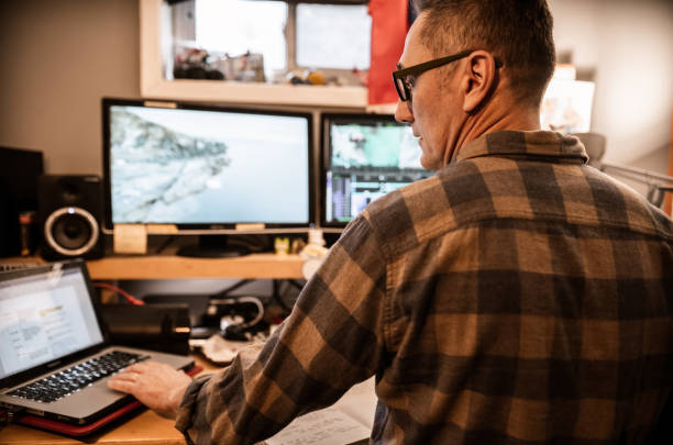 istock Male video editor working at home 1287440197