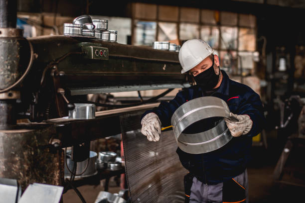 istock Mature man in factory workshop working alone during epidemic 1287440513
