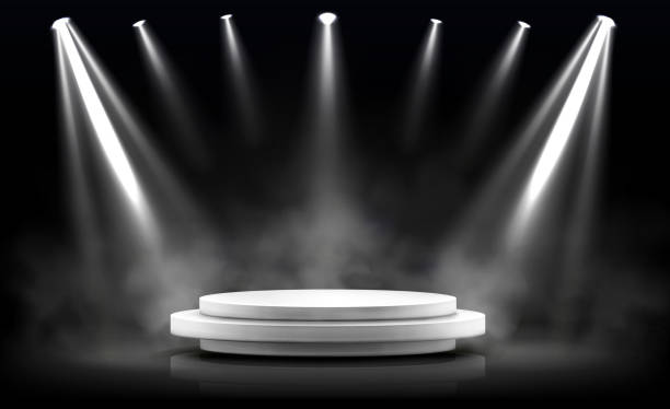 Round podium, empty stage illuminated by spotlight Round podium, empty stage illuminated by spotlights. Vector realistic mockup of circular platform, white pedestal, projector beams and smoke on black background. Round stand in showroom floodlight stock illustrations