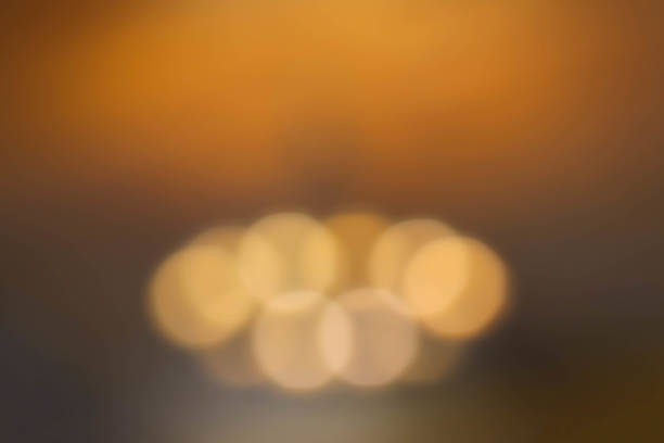 istock abstract blur of interior inside coffee cafe shop background with light effect for design element. Blurred cafe background with bokeh. orange ,red, light. 1287440886