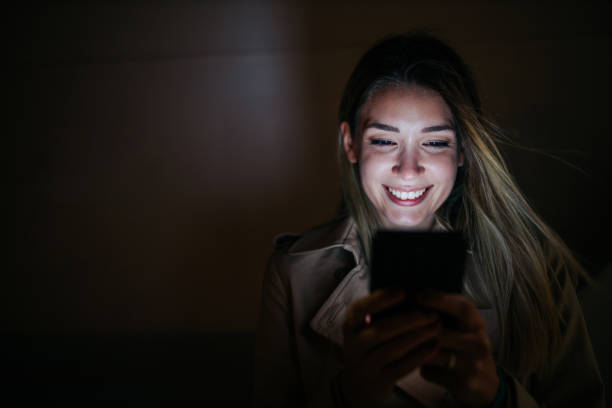 istock A young woman using her cellphone while out in the city 1287441452