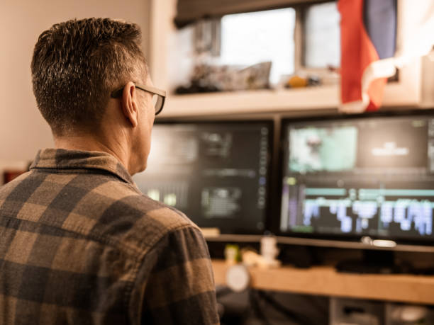 istock Male video editor working at home 1287441487