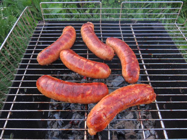 istock Grilled beef sausages grilled on coals on the grill 1287441928