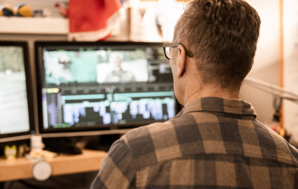 istock Male video editor working at home 1287442215