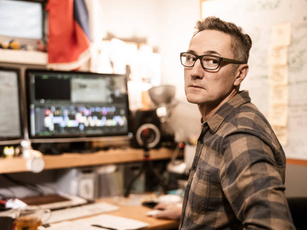 istock Male video editor working at home 1287442447