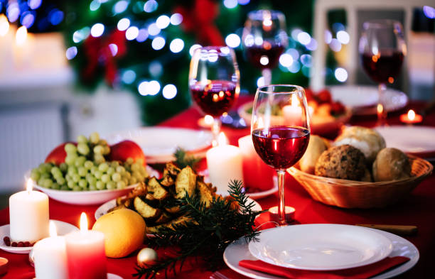istock Bright decorated big new year dinner table with christmas tree on background 1287442569