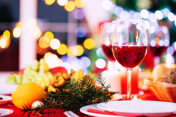 istock Bright decorated big new year dinner table with christmas tree on background 1287443958