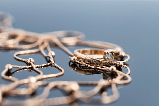 istock A gold ring with diamond  and a gold chain necklace 1287445062