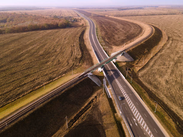 istock Aerial Top View of highway intersection junction summer morning 1287445356