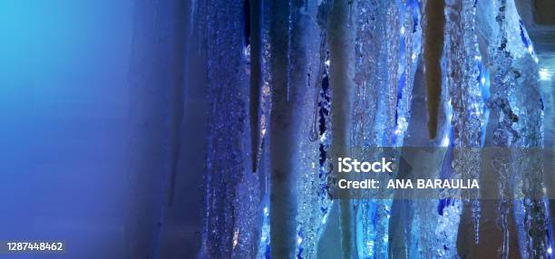 Hanging Icicles In Selenium Tone In Neon Light Chrstmas Background Stock Photo - Download Image Now