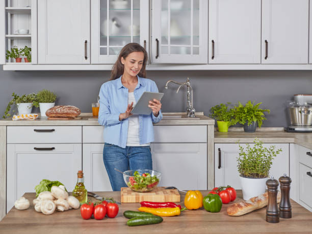 istock Woman choosing the best receipe 1287449244