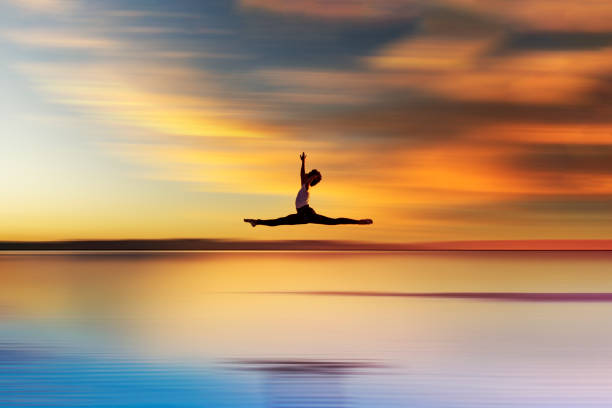 istock ballet dancer doing grand jet on water 1287451805