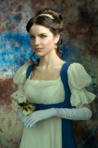 beautiful young woman in historical costume on blue background - princess women duchesses renaissance imagens e fotografias de stock