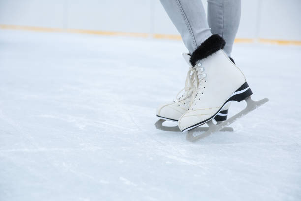 istock ice skating on the rink in motion close up. 1287455089