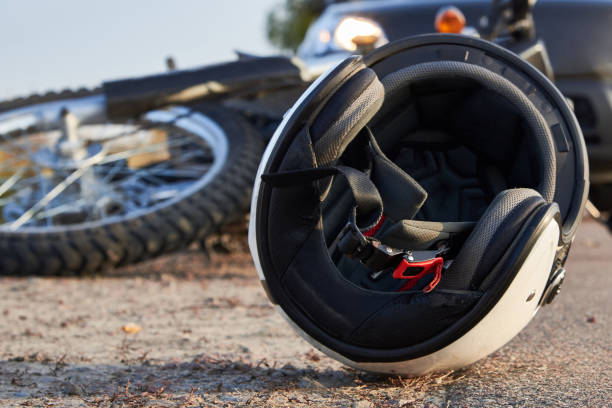 photo of car, helmet and motorcycle on the road, the concept of road accidents. - motocicleta imagens e fotografias de stock