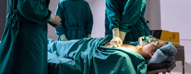 istock Surgeon and nurse do CPR to patient. Panorama 1287455528