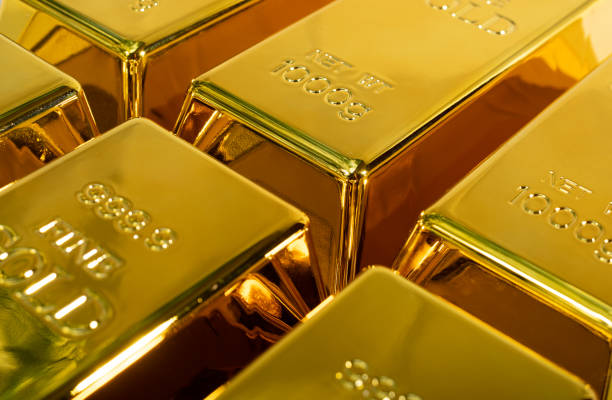 istock Closeup shiny a gold bar 1 kg on white background 1287455534