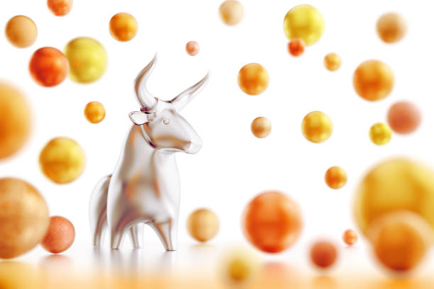 Metallic statuette of a cartoon bull standing amongst the varicoloured balls on white background. 3D rendered graphics on the theme of Chinese New Year - The Year of the Bull.