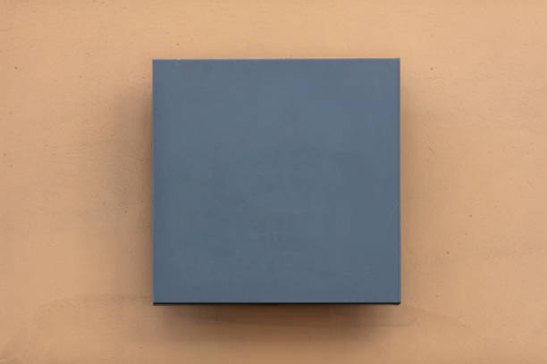 Blank metal wall sign mock up, Square shape gray signage on orange color wall background, empty template, copy space.