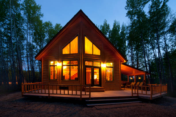 istock Cabin in woods at dusk 1287459925