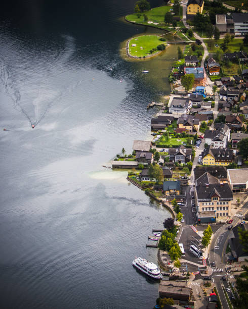 istock Birds eye view on a village next to a large lake 1287459976
