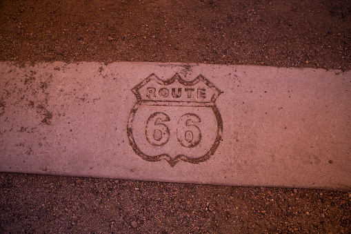 Route 66 marker on desert road