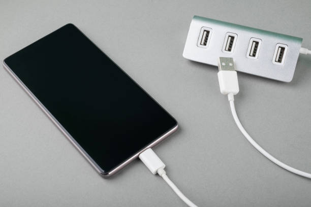 istock Charging a mobile phone connected to electricity for recharging. 1287460712