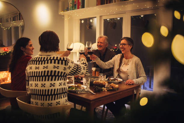 istock Family toasting wine at Christmas dinner 1287463482