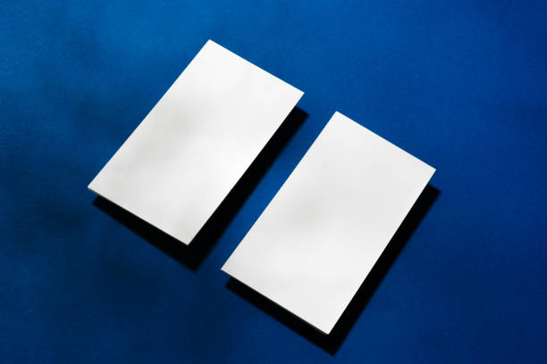 istock Two stacks of blank businesscards on blue background 1287463537