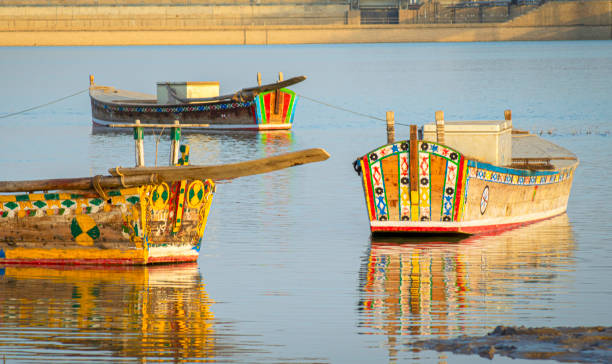 view of boats in the indus river - moody sky water sport passenger craft scenics imagens e fotografias de stock