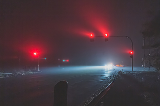 red traffic lights in foggy night