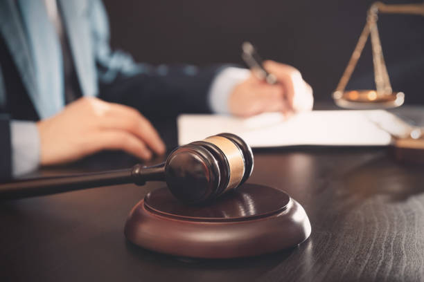 istock Lawyer, attorney with gavel at work. Law concept 1287464124