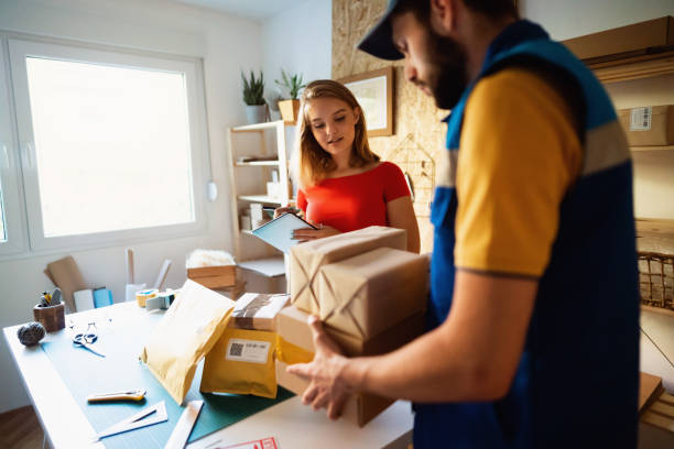 istock Young online business owner preparing packages it for delivery 1287464356