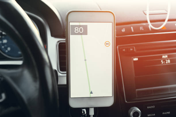 istock Smartphone with open gps navigation app on torpedo in car 1287464377