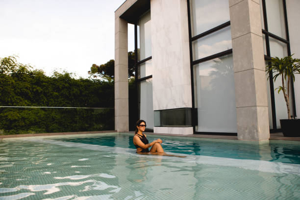 istock women enjoying luxury pool 1287465246