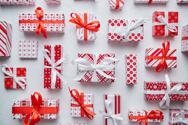 istock Various pattern and size Christmas boxes placed on white background. Wrapped in festive paper 1287466656