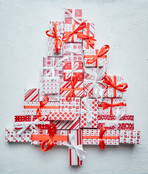 istock Colorful Christmas tree formed from different various pattern and size boxed gifts 1287466662