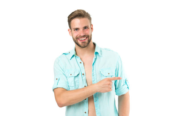 istock Look there. Man handsome bearded guy smiling on white background isolated. Guy cheerful smile macho pointing to side with finger. Positive emotions. Man with sincere smile. Good mood. Brilliant smile 1287468161