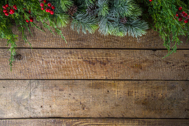istock Christmas Fir Tree On Wooden Background 1287468257