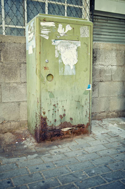 istock A green mail storage box is set on the sidewalk. Its underside is severely rusted from dog urine. 1287469753