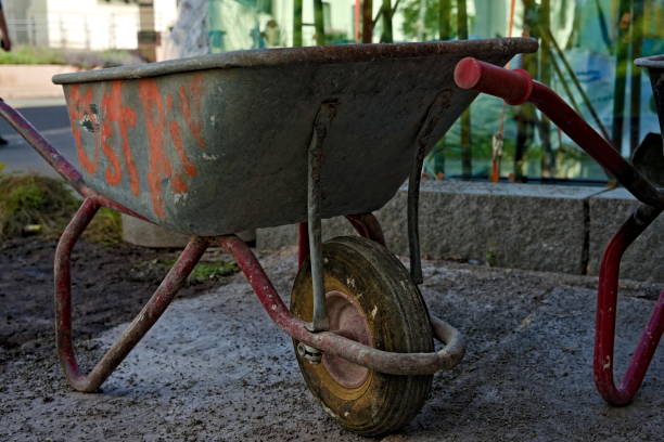 istock Dirty and used wheelbarrow at a urban construction site. 1287470769