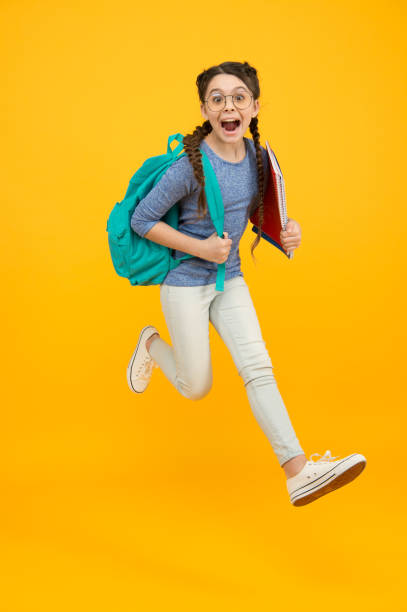 istock School student small girl going to school knowledge day, hurry up concept 1287472248