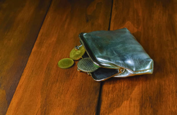istock Wallet with coins of different countries 1287472780