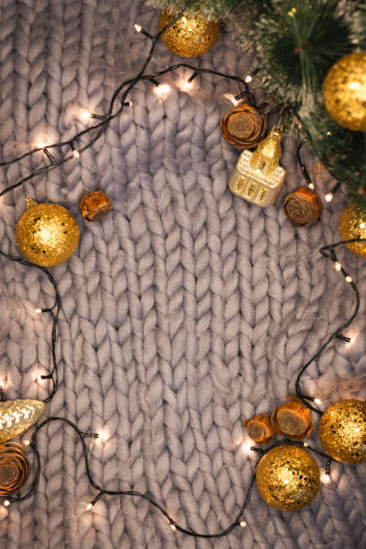 istock Christmas decorations on a gray knitted background with copyspace 1287474217