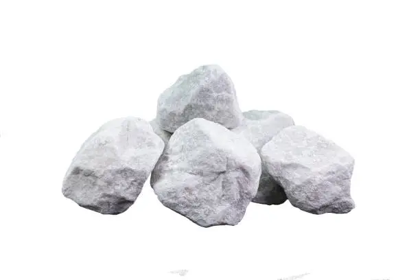 Marble rubble on a white background in the form of a pile of stones. Marble crushed stone fraction is used in landscape design, construction, and aquarium soil
