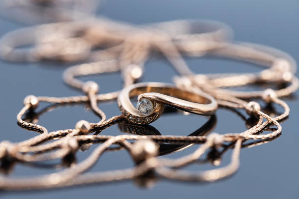 istock A gold ring with diamond and a gold chain necklace 1287482604