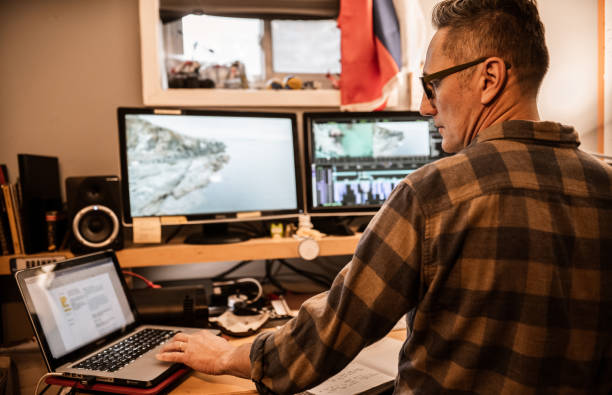 istock Male video editor working at home 1287486238