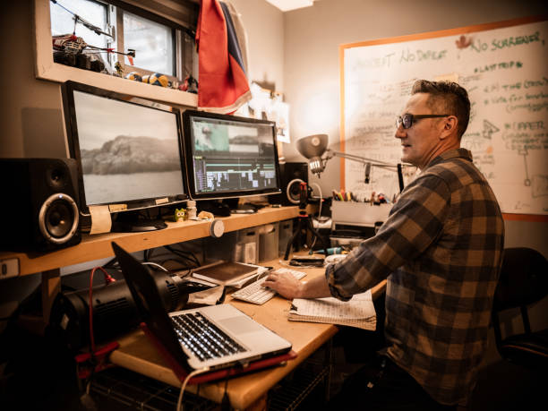 istock Male video editor working at home 1287487435